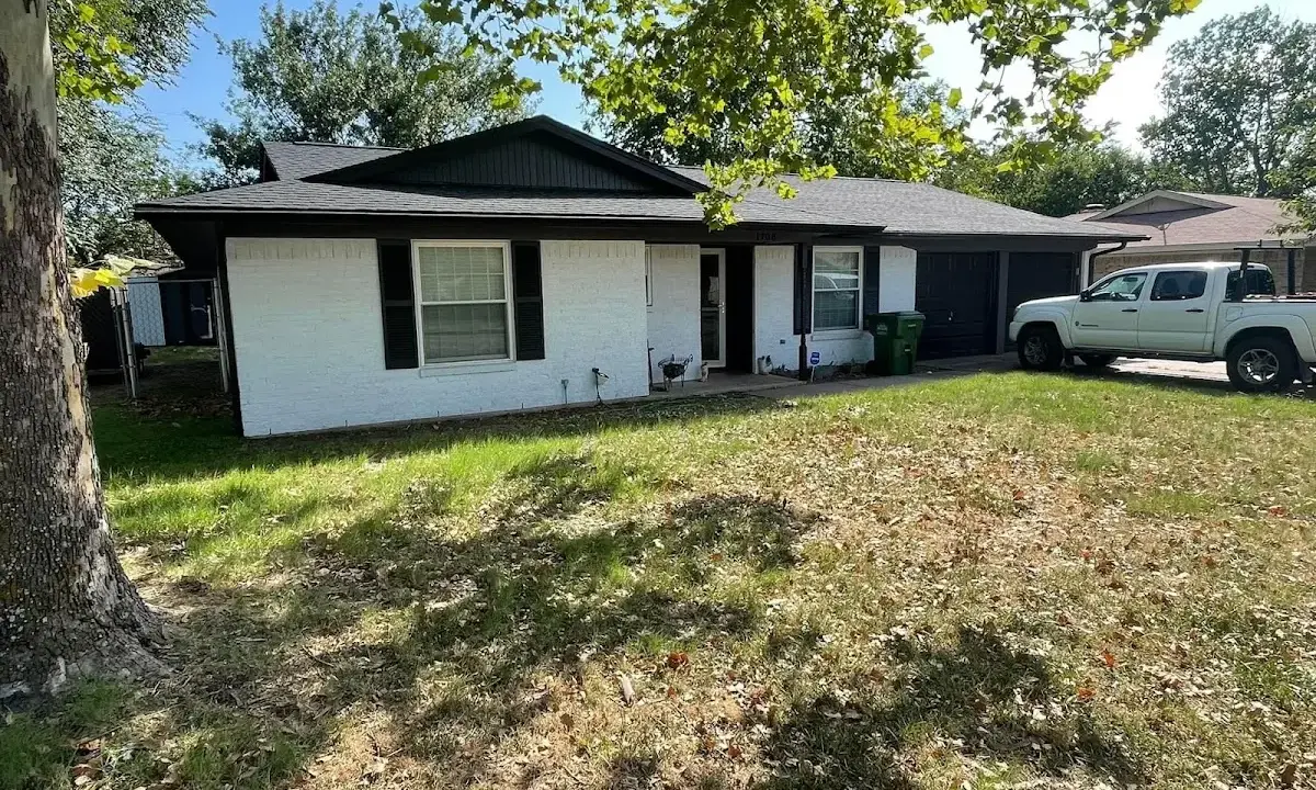 Professional roofing crew working on a residential roof in Bernards
